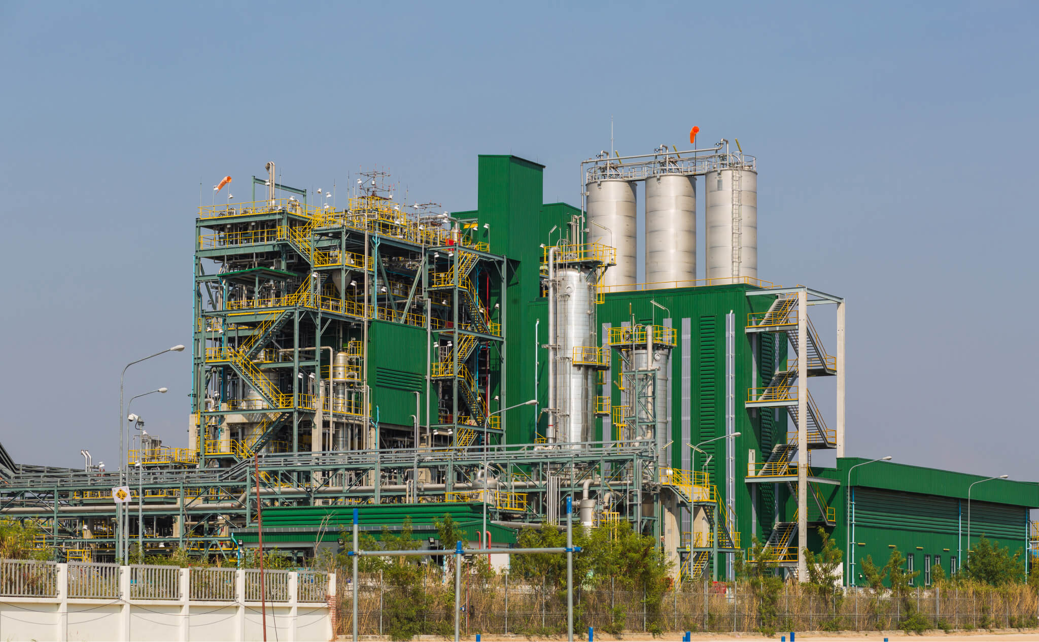 Detail of Chemical processing plant against a blue sky