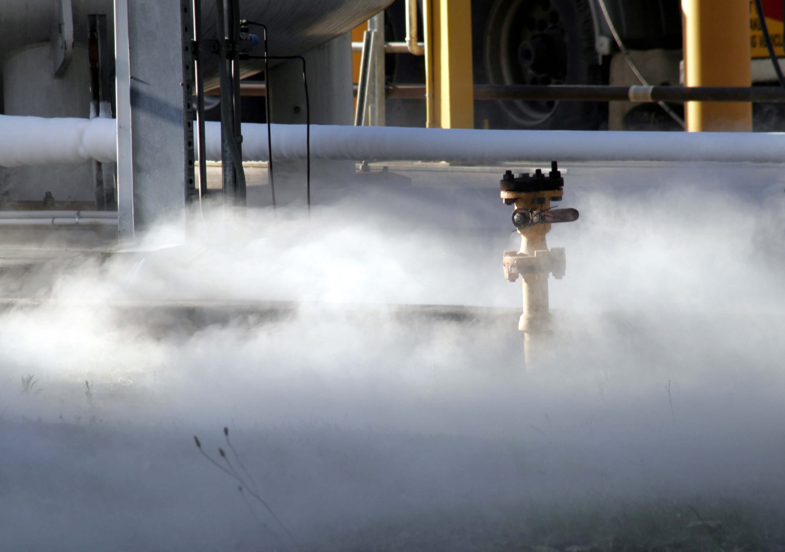 Image of toxic gases being released on the floor of a refinery plant