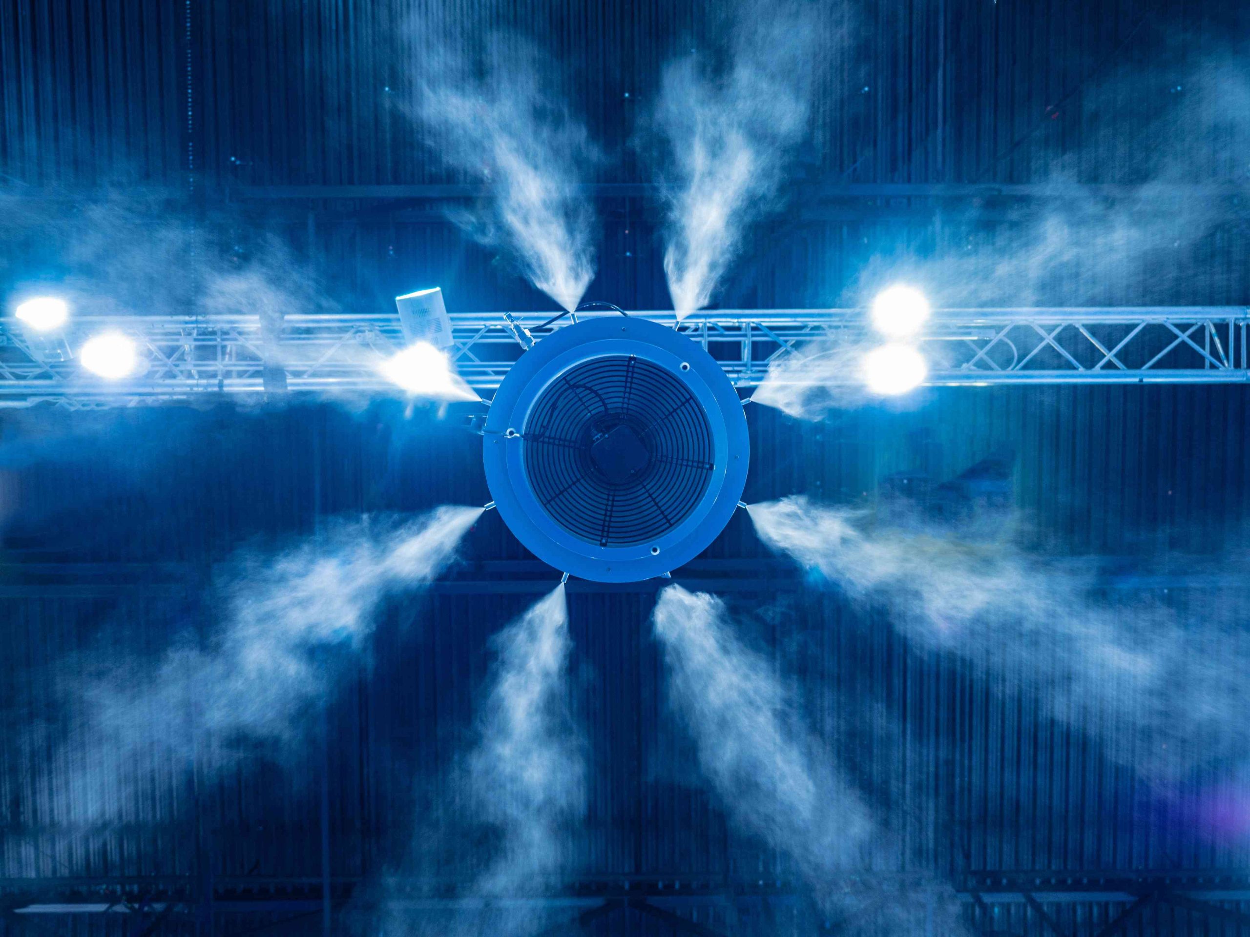 Looking up at an industrial air humidifier in a greenhouse.